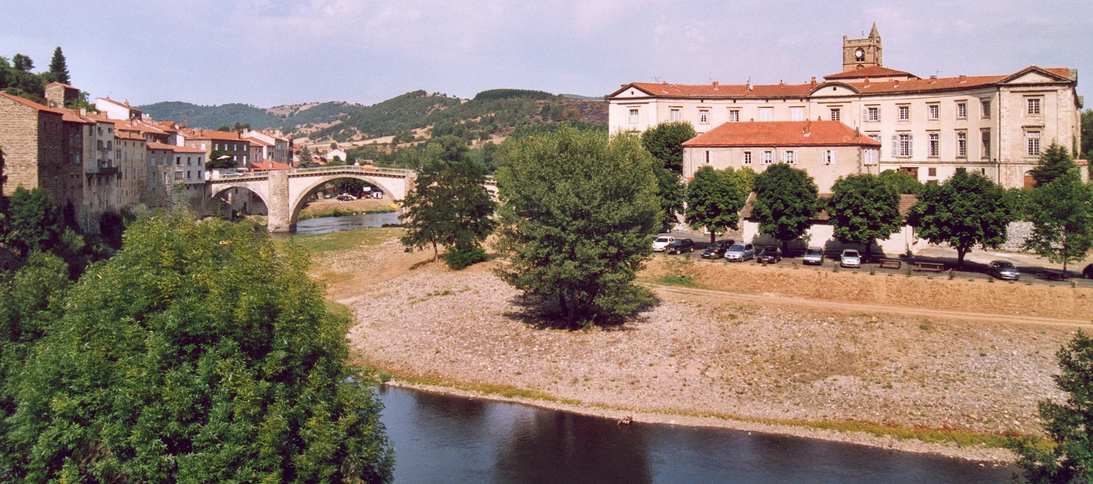 Aerial view of Lavoûte-Chilhac: the priory and stone bridge in a bend of the Allier