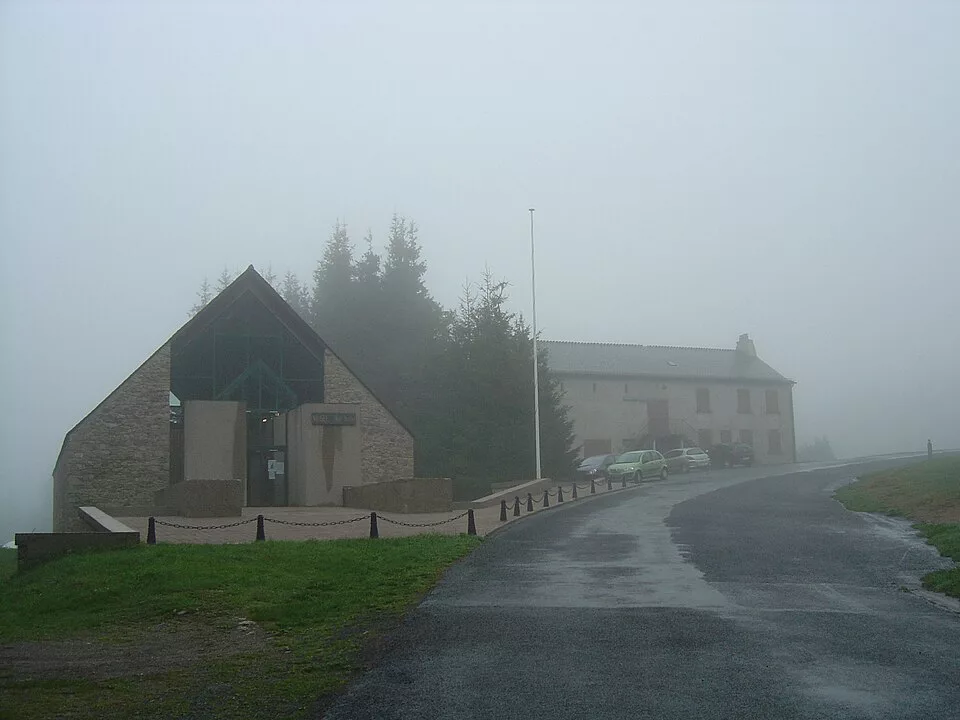 The Resistance Museum, with a fir forest behind it