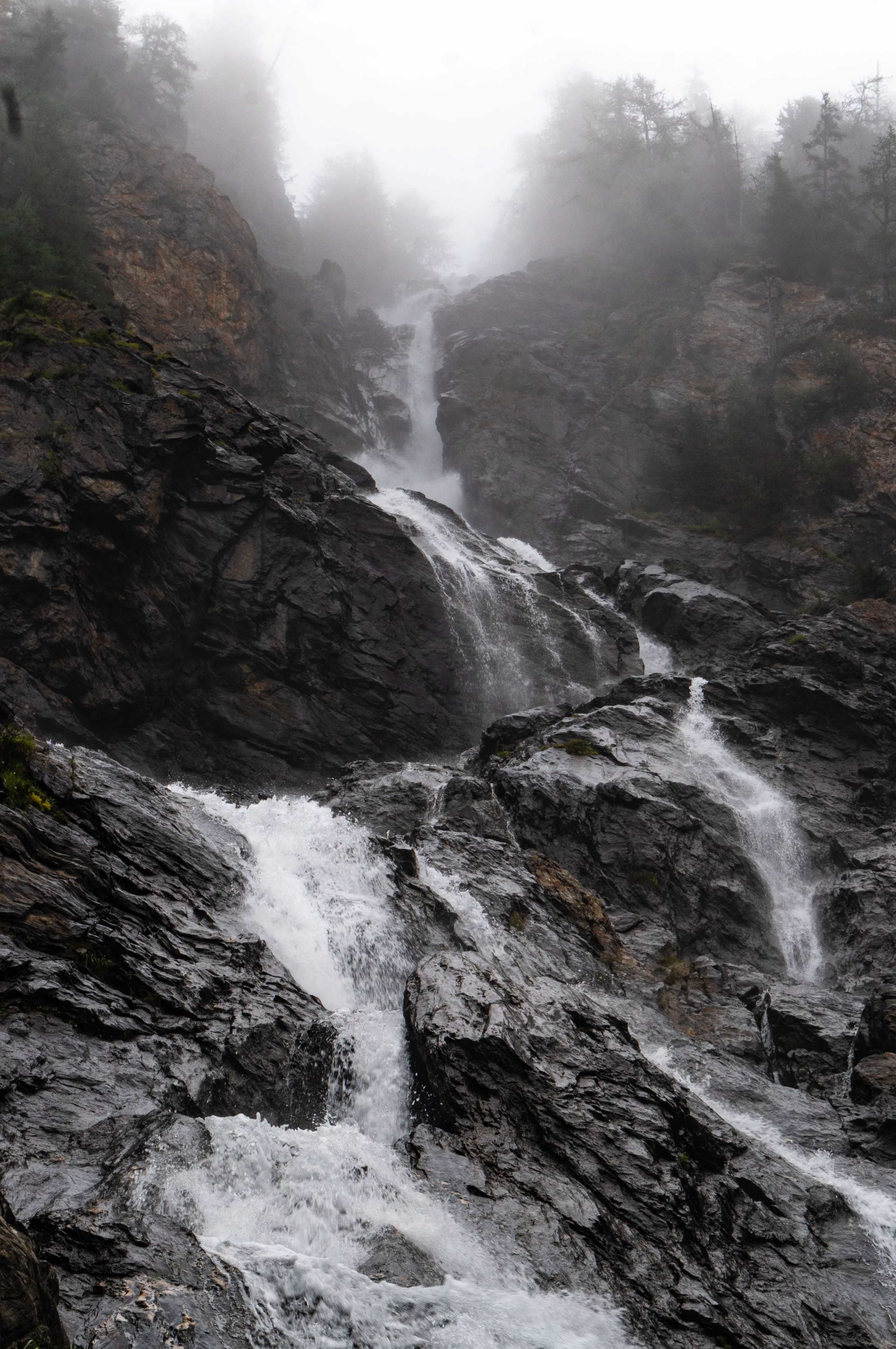Misty waterfall tumbling down a rock face